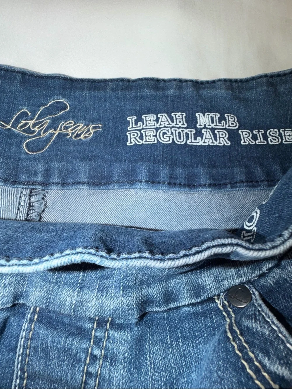 Lola Leah MLB Mid-Rise Bootcut Flared Stretch Jeans in Medium Blue Wash 8. A50